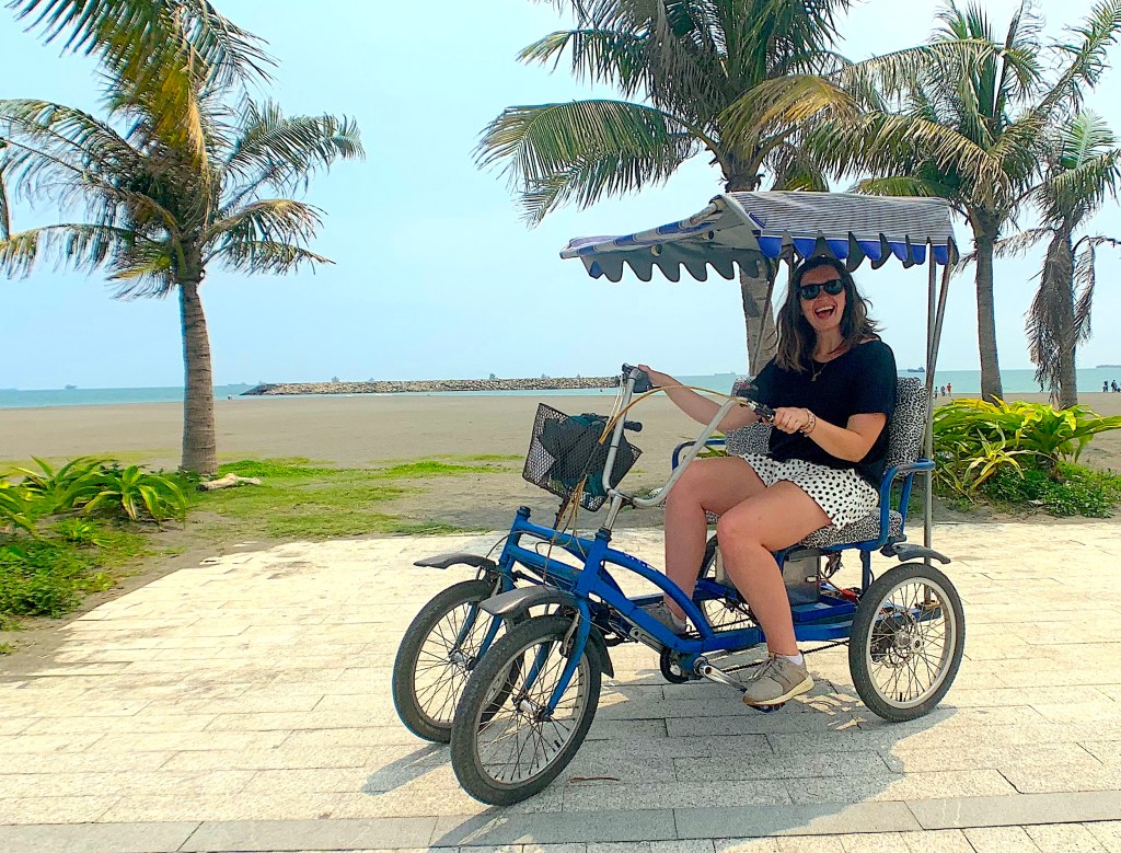 Girl sits in a pedicab on Cijin Island, Kaohsiung, Taiwan.