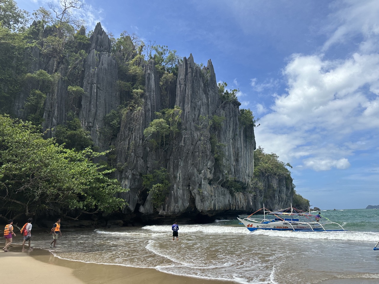 photo-of-cliffs-and-beach-when-arriving-at-underground-river-bay